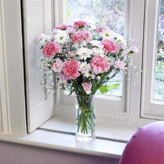<p>A simple collection of pink long stemmed standard carnations, white spray chrysanthemums, white spray carnations, pink spray carnations and gypsophila combine to made this attractive display.</p><p>Expertly hand-tied this simple arrangement is sure to impress and is guaranteed to last.</p>