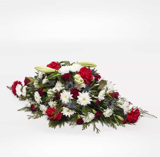 <p>This Classic Spray is pointed at both ends and is approximately 60cm long (2 feet)</p><p>Can be customised to be colour appropriate to suit a lady or a gent. Contains several Lilies as well a range of fresh Chrysanthemums and Carnations expertly arranged. Perfect for an anniversary, month mind or a birthday. </p><p>If particular colours or flowers are required simple request them during the checkout stage.</p><p> </p><p> </p>