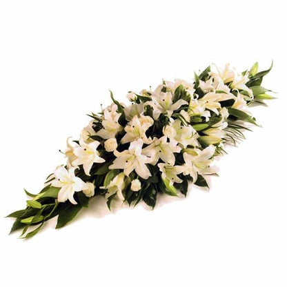 <p>An abundance of lilies create this striking but simple centrepiece.</p><p>Expertly arranged with the freshest of Lilies to create a memorable desplay on one of the saddest days.</p><p>Different colours and sizes can be arranged if required, simply contact us</p>