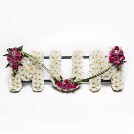 <p>A fitting tribute to a much missed Mum.</p><p>This stand out tribute is created using a mass of white double chrysanthemums and finished with pink roses to high light each letter.</p><p>Each letter measures approximately 30cm high and approximately 15cm wide.</p><p>If you would like this done in different colours please contact us directly.</p><p> </p><p> </p>