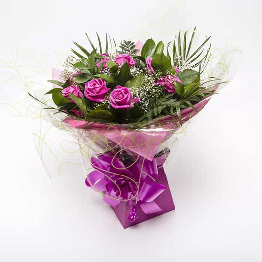 <p>Sending a dozen Roses says it all, Express just how you feel to someone special with one dozen roses. Tradationally pink roses are said to show thankfulness, admiration and happiness.</p><p>Expertly blended by our expert florists with Gypsophila and tropical foliage these beautiful roses are hand-tied and wrapped in seasonial wrapping and placed in a presentation box for all to enjoy.</p>