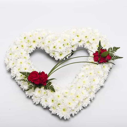 <p>A tribute to a love gone but not forgotten.</p><p>Finished here in a mass of white double chrysanthemums with red roses, this arrangement measures 45cm across (17") and can be decorated in different colours or styles if required.</p><p>Ideal for the remembrance of a loved one.</p><p>Simply contact us.</p><p> </p>