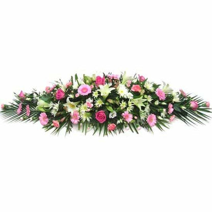 <p>A mixture of your choice of flowers expertly arranged will personalise this emotional centrepiece, Contact us directly to discuss your exact requirements. Ranges of colours and flower types can be suited to each individual customer.</p>